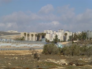 Since the security barrier was built, such as here in form of a wall, separating a Palestinian town from East Jerusalem, Palestinians have more problems in every day life such as reaching their land. Photo: PS